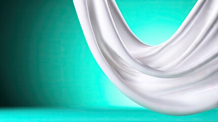 White Fabric Draped on Teal Background
