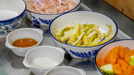 Ceramic bowls cradle vibrant stir-fry ingredients, invoking Lunar New Year feasts, cultural harmony, and an aromatic culinary journey