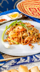 Sizzling shrimp nestled in tangy noodle tapestry, Lunar New Year feast, tantalizing umami harmony...