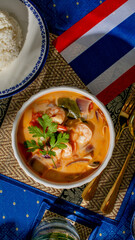 Aromatic tom yum soup with vibrant herbs, celebrating Songkran delights and savory symphony, Thai culinary festivity in a bowl