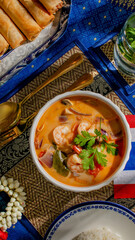 Aromatic Thai prawn curry, vibrant fusion flavors, Songkran celebration, turmeric-laden broth,...