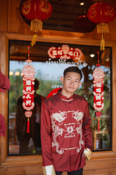 A man dressed in Chinese New Year clothing