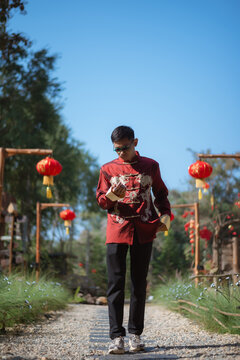 A man dressed in Chinese New Year clothing
