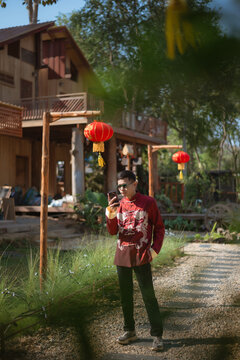 A man dressed in Chinese New Year clothing