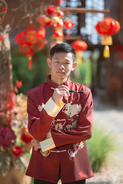A man dressed in Chinese New Year clothing
