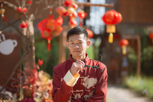 A man dressed in Chinese New Year clothing