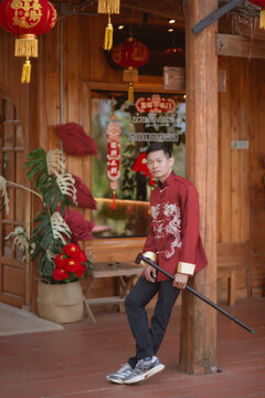 A man dressed in Chinese New Year clothing