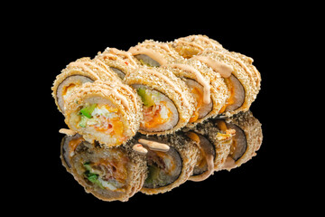 Crispy deep-fried sushi rolls filled with colorful vegetables and seafood are topped with a creamy...