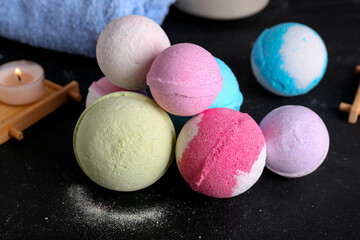 Bath bombs on black table, closeup