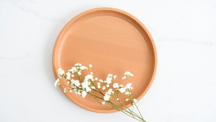 Oval terracotta plate with delicate white baby s breath flowers