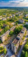 Aerial view of abandoned Soviet-era military town with crumbling buildings and overgrown vegetation