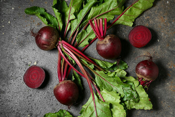 Fresh cut beetroots on grey grunge background
