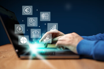 Hands engaged in financial analysis on laptop with digital icons representing currency, graphs, and calendar