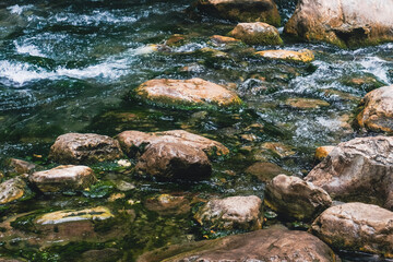 Foamy Stream Gently Finding Its Way Between Stones

