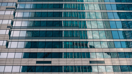 Fototapeta premium walls and empty windows of a modern building on a big city street without people