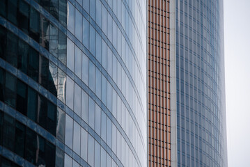 Fototapeta premium walls and empty windows of a modern building on a big city street without people