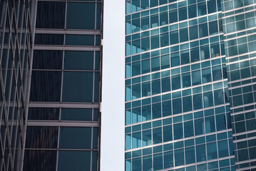 walls and empty windows of a modern building on a big city street without people