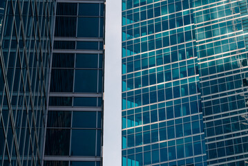 walls and empty windows of a modern building on a big city street without people