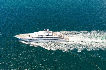 Aerial view luxury motorboat in sea. Summer sea vacation. Boat trip. Luxury lifestyle and traveling. Sea boat go to yacht marina. Yachting and boating marina. Yacht boat sailing