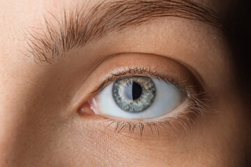Young woman with gray-blue eyes, closeup