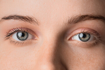 Woman with beautiful green eyes, closeup
