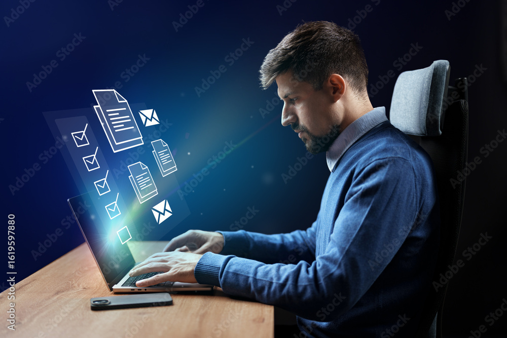 Poster professional man working on laptop with virtual documents and messages in a modern office setting at