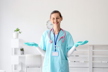 Female medical intern with gloves in clinic
