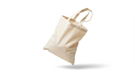 An empty, floating beige canvas tote bag with subtle shadow, isolated on a white background
