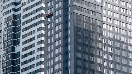 Fototapeta premium empty glass windows of a modern building with a reflection of the sky in the glass