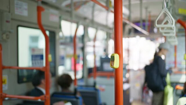 Blurred view of people inside a bus in the Gion area in Kyoto, Japan in daylight