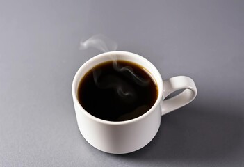 Steaming coffee in a simple white mug on a grey background, still life, steam