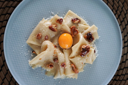 Close up Walnut alla Carbonara Pasta with sous vide poached egg