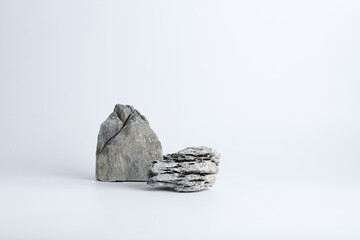 nature gray pebble stone gravel and grey boulder rock on desktop tabletop white clean background