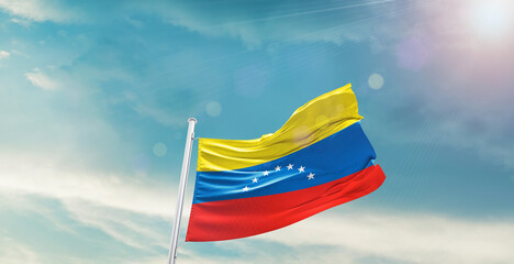 Venezuela national flag waving with beautiful sky.