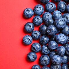 Fresh blueberries on red background