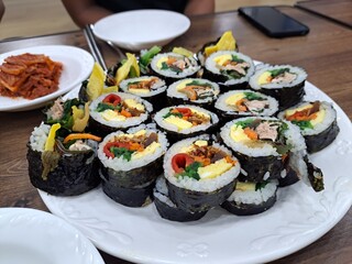 sushi on a plate with chopsticks