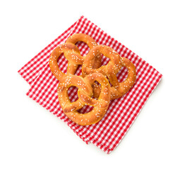 Tasty salted pretzels on white background