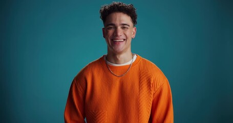 Face, man and confident for fashion in studio background with smile, trendy clothes and style. Portrait, male person and pride with casual outfit, winter apparel and good mood for positive attitude - Powered by Adobe