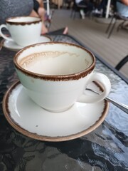 Empty Coffee Cup on a Cafe Table