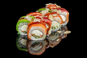 Colorful sushi rolls with salmon, tuna, avocado, cream cheese, and almond flakes arranged on a...