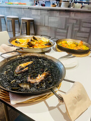 Traditional Spanish paella cooked in a large pan, served fresh in Barcelona