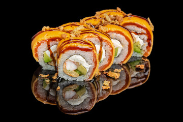 Colorful sushi rolls topped with vibrant orange sauce, cream cheese, avocado, and crispy onions on...