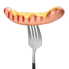 Grilled Sausage with mustard on a fork isolated on white background.