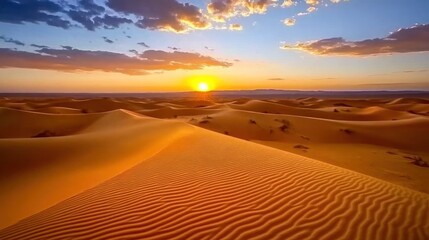 Dramatic sunset over vast sand dunes in Sahara desert.