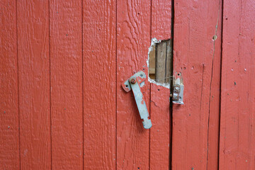 Broken Lock on Red Wooden Door