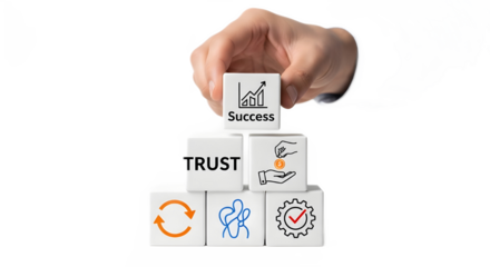 Hand building a business success pyramid with blocks for trust, strategy, and investment