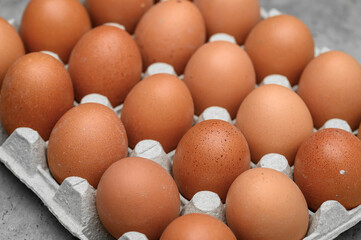 Eggs in carton box closeup