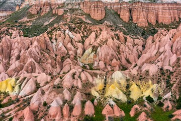 Red and rose valley landscape rock formations in Cappadocia
