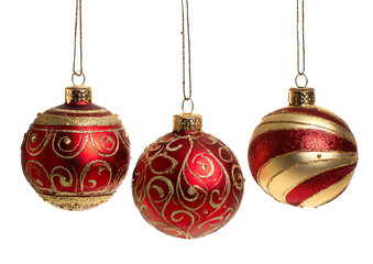 Three red and gold Christmas ornaments hanging
