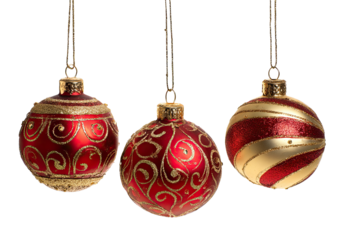 Three red and gold Christmas ornaments hanging